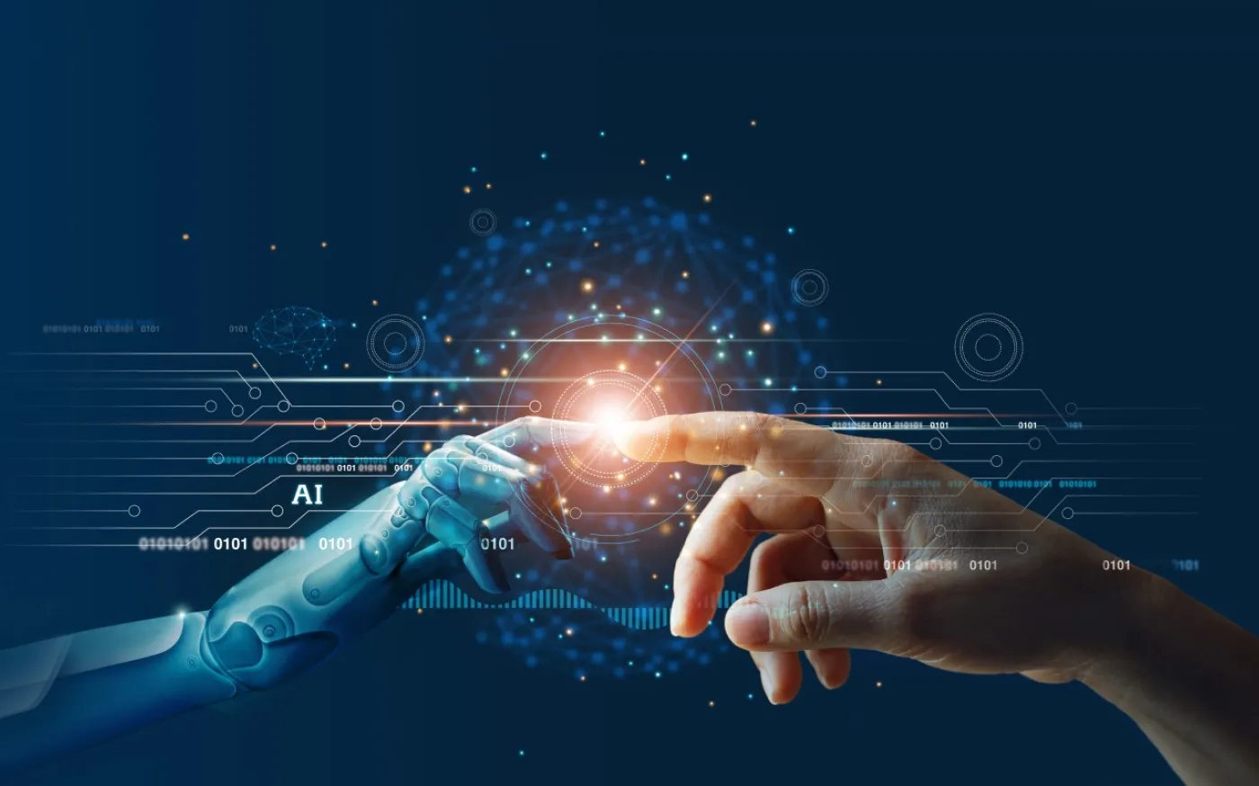 Hands of robot and human touching